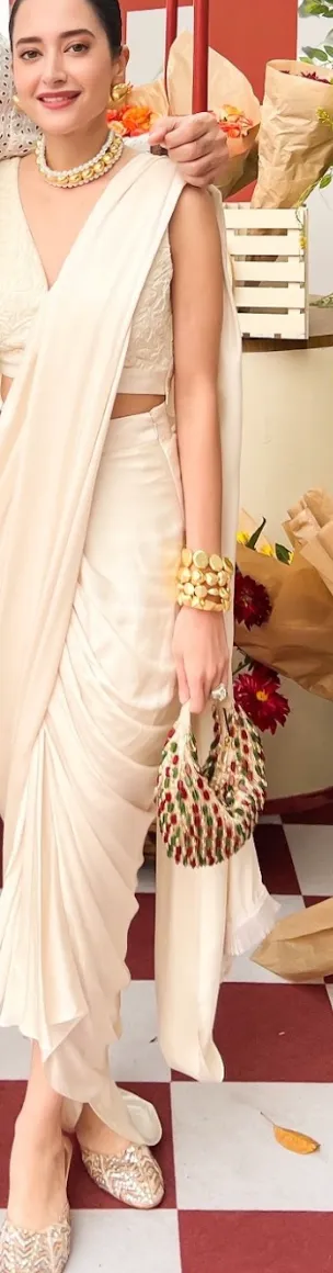 Komal Kapoor in our Red Green Multi Nano Boat Bag